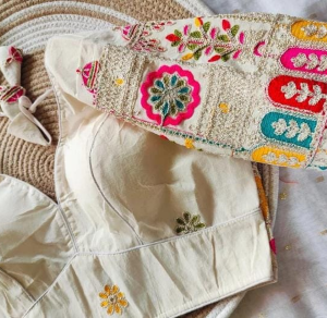 Cream base with vibrant multicolour embroidery