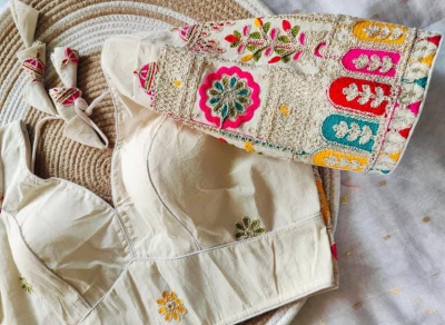 Cream base with vibrant multicolour embroidery