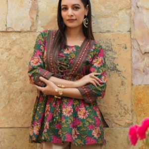 Rich green base with vibrant floral print Kurti